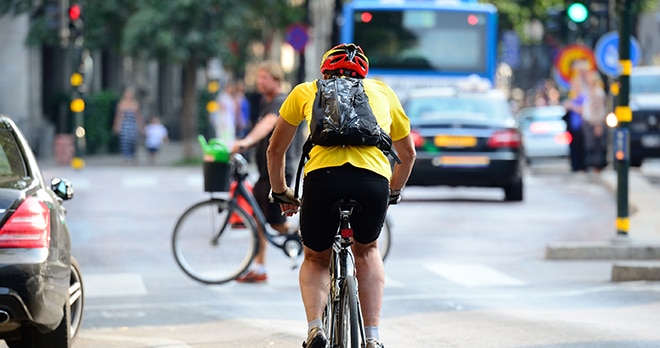 Cyclist on busy road