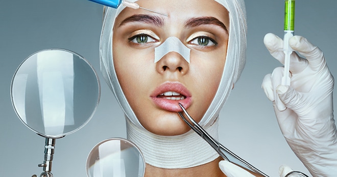 Bandaged woman with cosmetic surgery implements