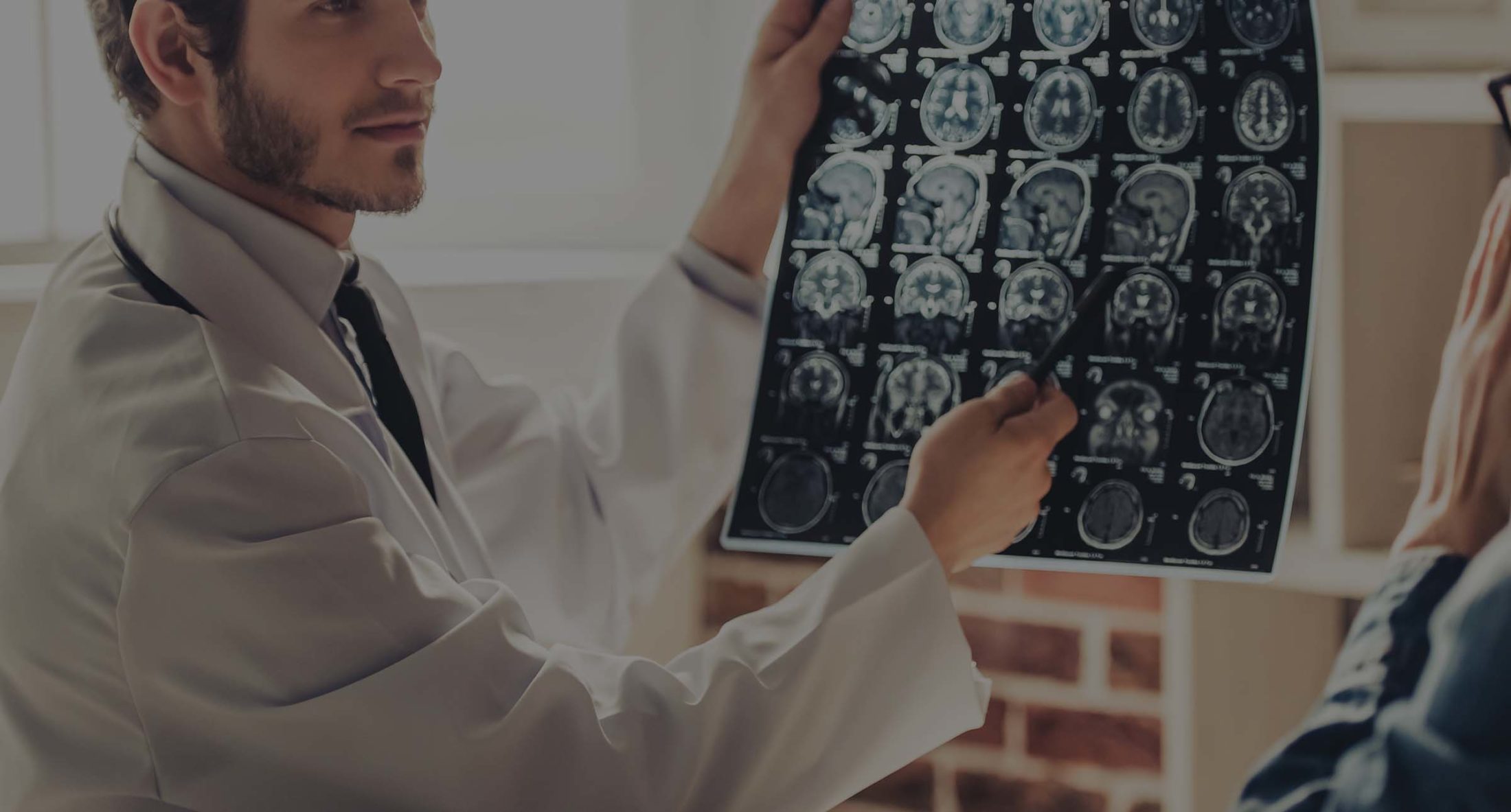 Doctor indicates brain injury on brain scans