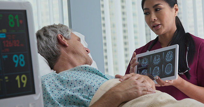 Female medical professional explaining a brain injury diagnosis to patient