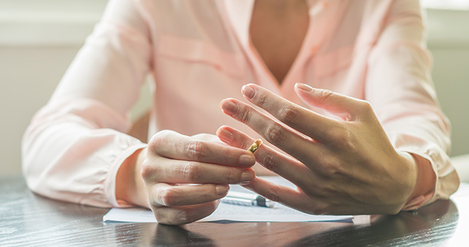 Woman removing her wedding ring